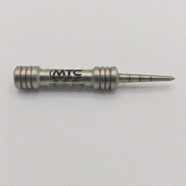 Stainless steel barbell divot tool laser engraved with a company logo and serial number