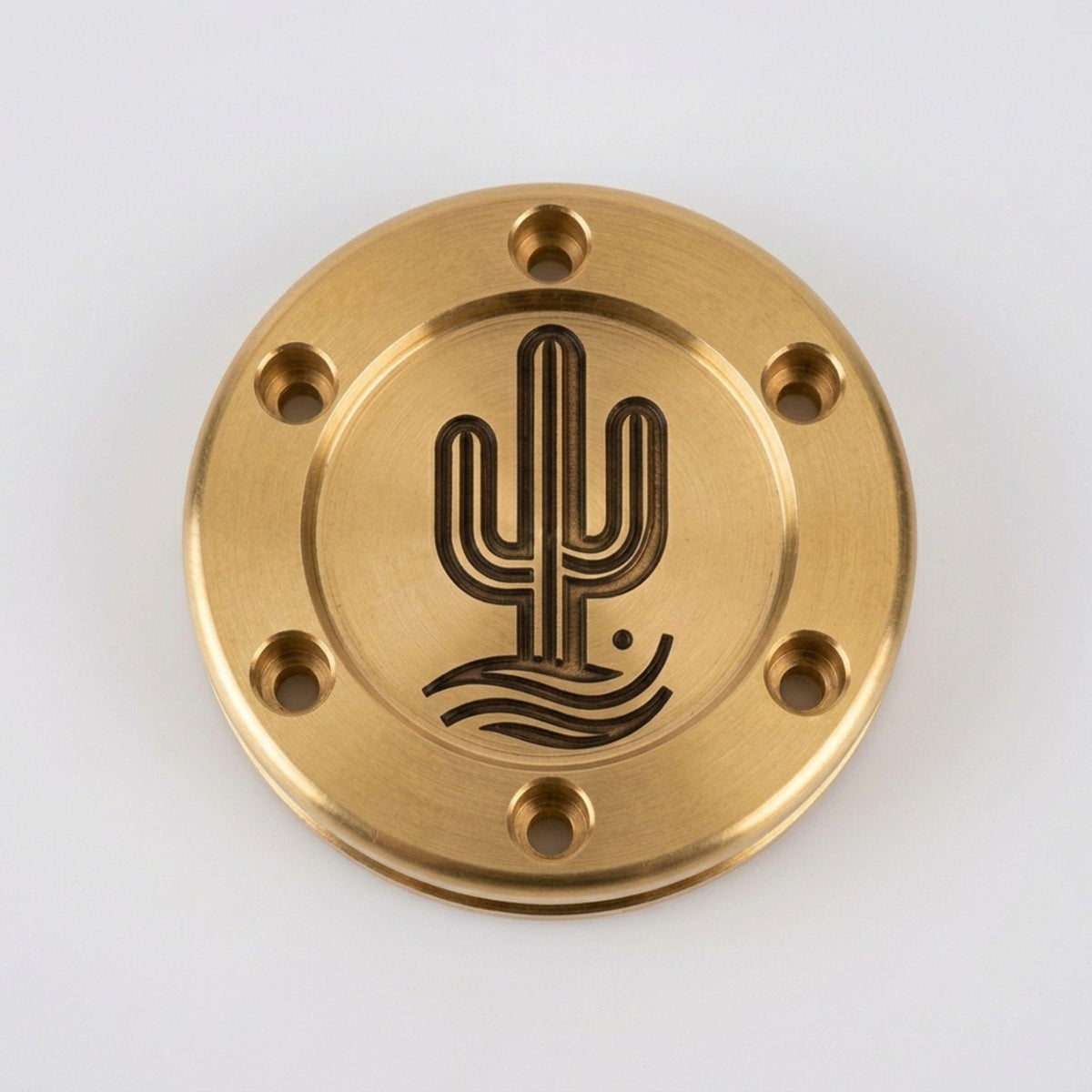 Bronze putter weight engraved with a cactus design
