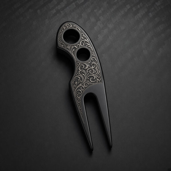 Black Trapper divot tool with filigree scrollwork engraved around the head