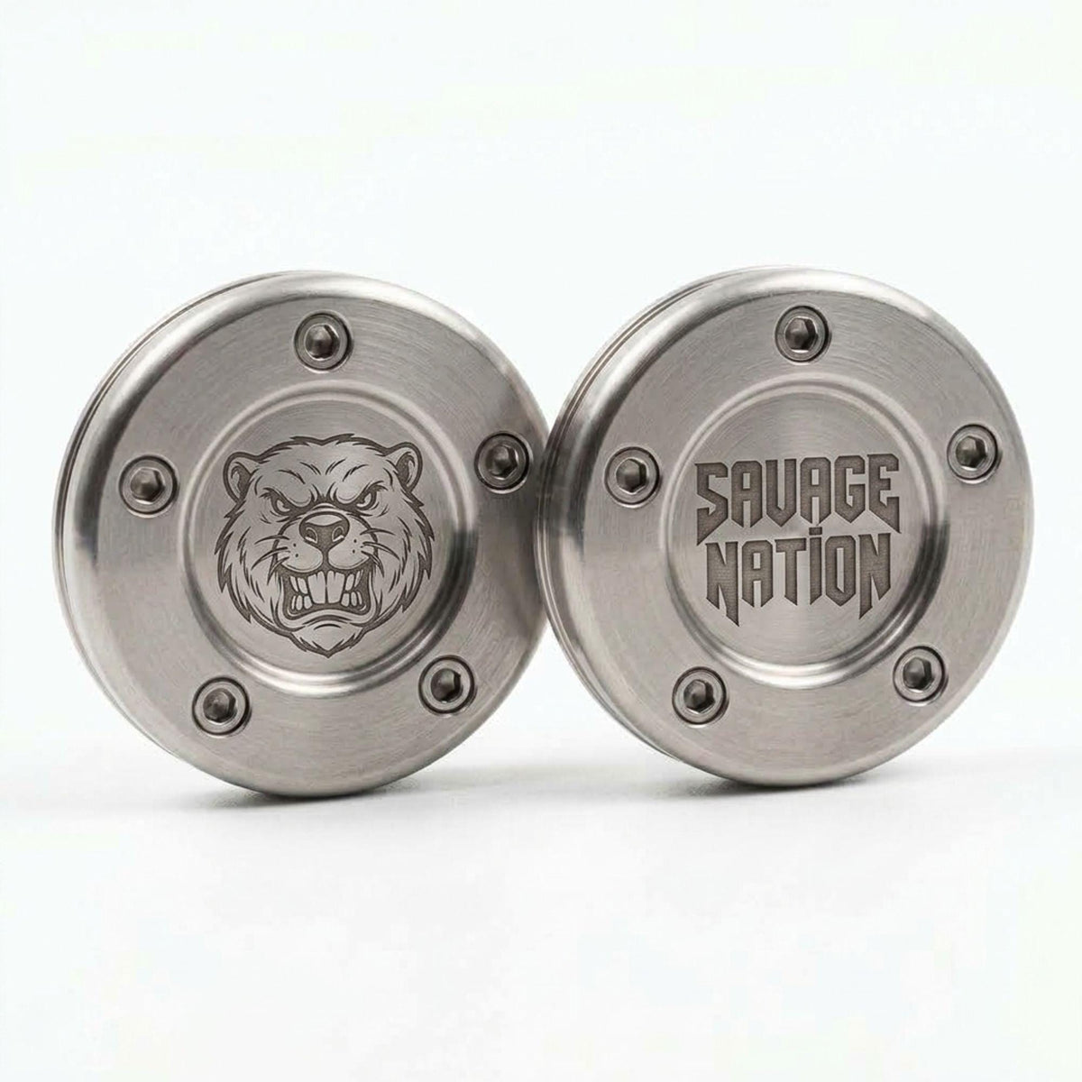 Pair of stainless putter weights engraved with a beaver logo and SAVAGE NATION text